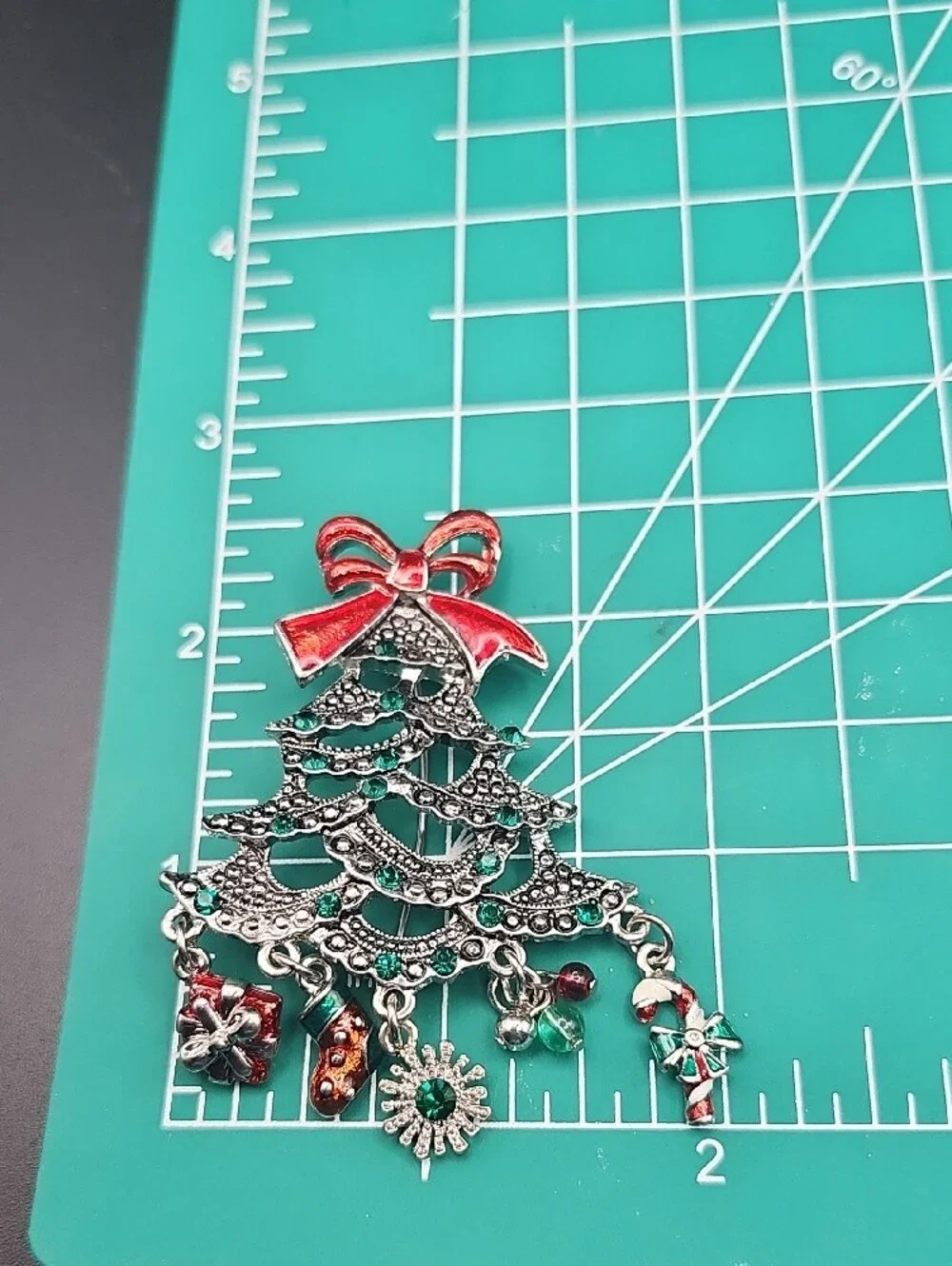 Festive Silver-Tone Christmas Tree Brooch with Red Bow and Emerald Accents